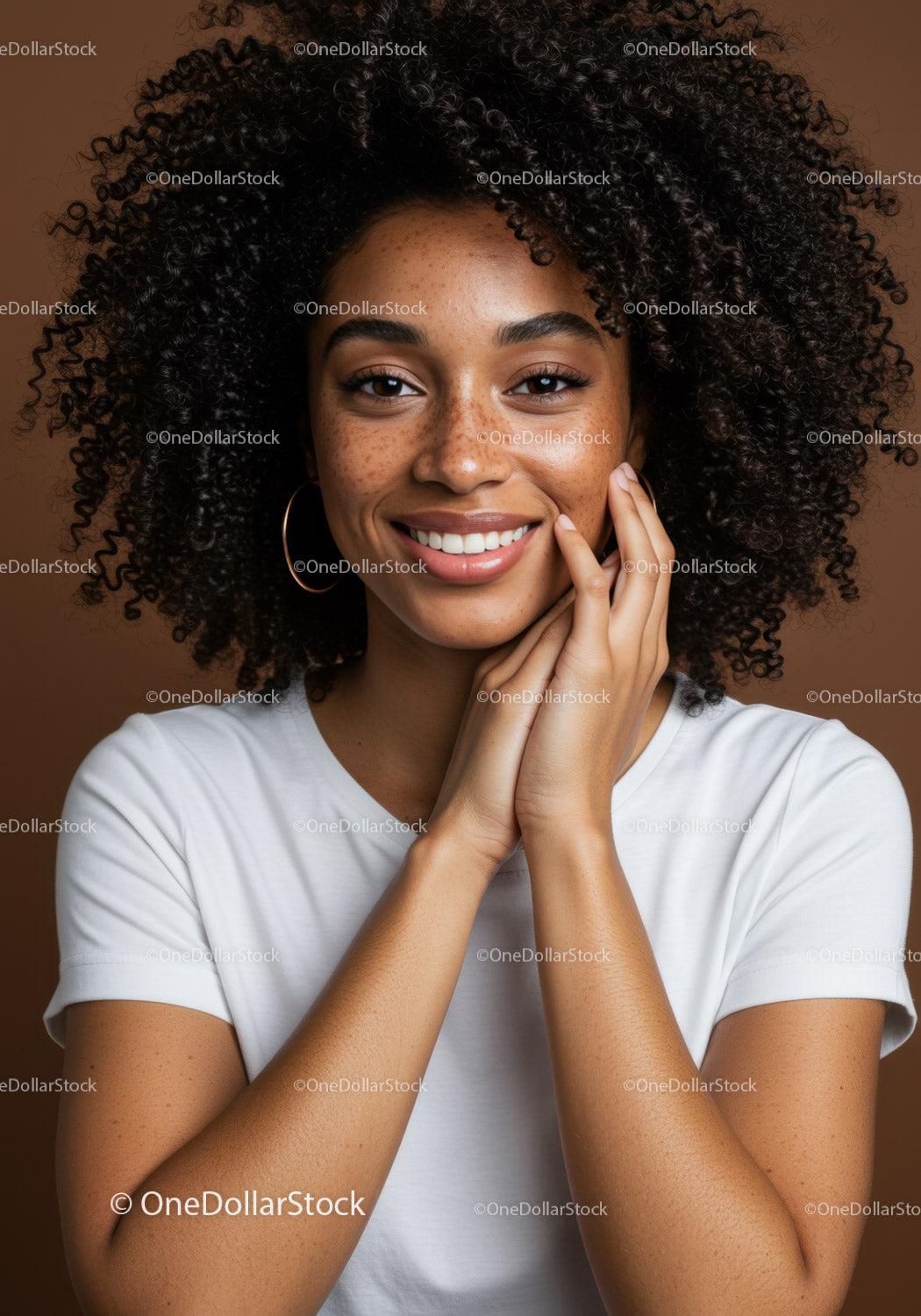 Smiling Woman with Curly Hair and Freckles in a Studio Portrait