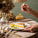 Elegant Lemon Tart Slice with Fresh Lemon Garnish on Stylish Table