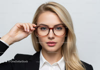 Elegant Blonde Woman in Business Attire Wearing Stylish Glasses