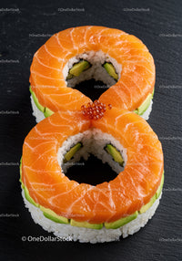 Salmon and avocado sushi rings with caviar topping