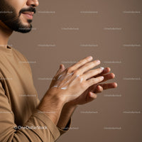 Man Applying Lotion on Hands for Moisturizing Skincare Routine