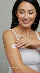 Woman Applying Lotion for Healthy Skin in Skincare Routine
