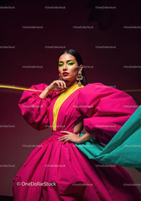 Fashion Model in Vibrant Pink and Yellow Flowing Gown