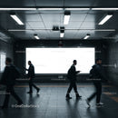 Commuters walking past bright billboard in subway station