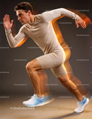 Athlete sprinting fast in beige sportswear with motion blur