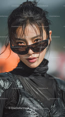 Confident Female Model in Stylish Black Outfit and Sunglasses