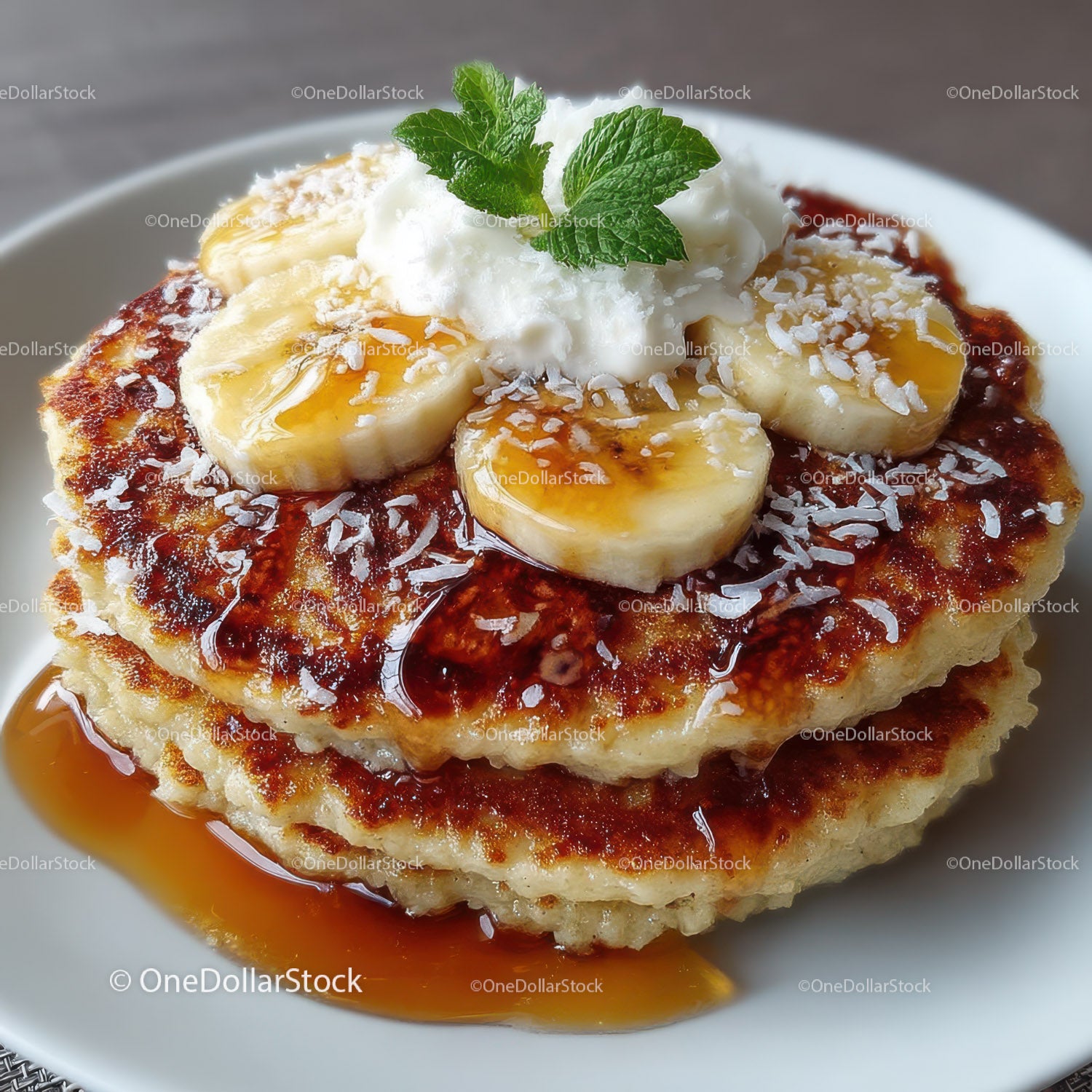 Banana Pancakes with Syrup and Whipped Cream on Plate