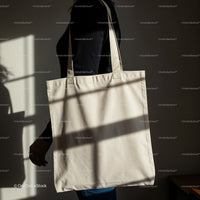 Person Carrying Minimalist Canvas Tote Bag in Soft Light