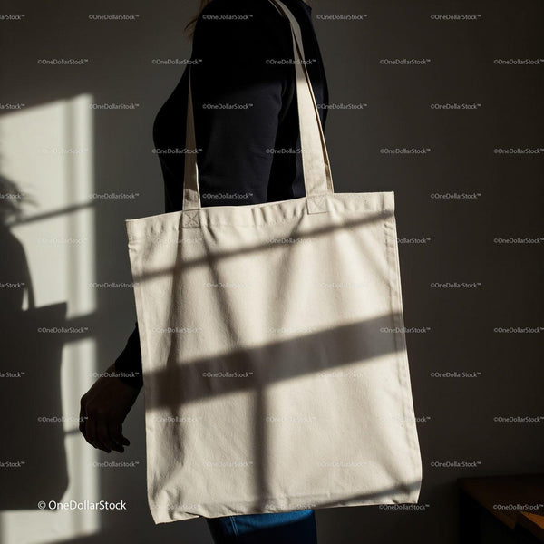 Person Carrying Minimalist Canvas Tote Bag in Soft Light JPG Mockup Image
