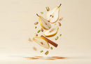 Fresh sliced pears with cinnamon and pistachios floating
