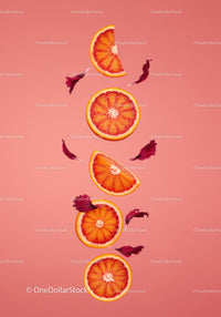 Blood Orange Slices with Hibiscus Petals on Pink Background