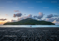 Scenic Mountain Island Over Calm Beach at Sunset
