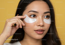 Portrait of a woman applying eye masks for skincare relaxation