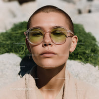 Stylish Woman Wearing Sunglasses and Beige Coat Outdoors