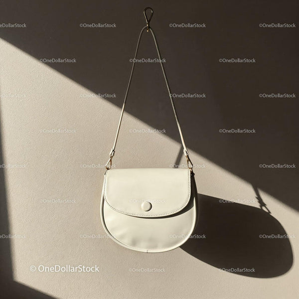 Minimalist White Leather Crossbody Bag Hanging on Wall JPG Mockup Image