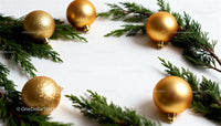 Golden Christmas ornaments with fresh green pine branches