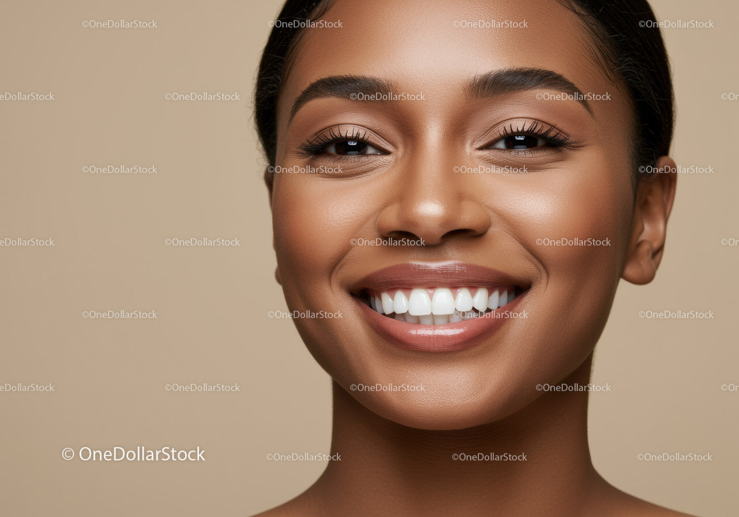 Closeup of smiling young woman with glowing skin