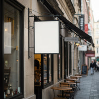 Empty street cafe with blank hanging sign in city