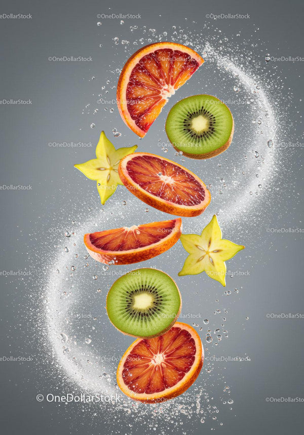 Fresh fruit slices immersed in sparkling water bubbles