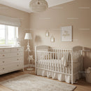 Elegant Baby Nursery with White Crib and Cozy Decor