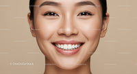 Close-up of joyful young woman with radiant smile