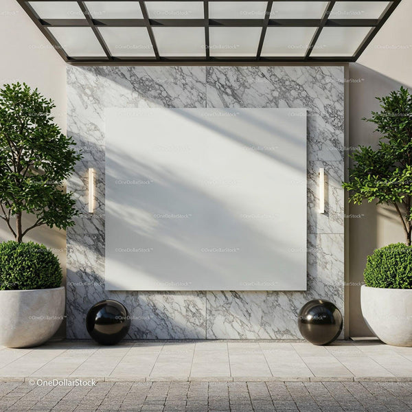 Modern empty billboard on marble wall with green plants JPG Mockup Image
