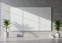 Minimalist room with blank canvas and tropical plants
