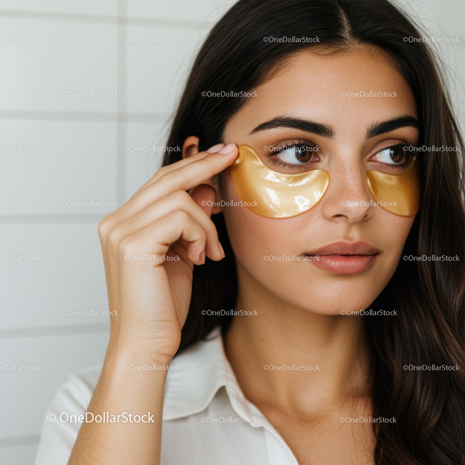 Young woman receiving skincare eye patch treatment for rejuvenation