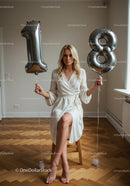 Blonde woman celebrating 18th birthday indoors