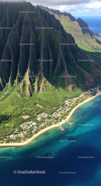 Breathtaking Mountain Range Overlooking Clear Blue Ocean in Tropical Paradise