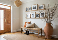 Minimalist entryway with wooden bench and neutral decor