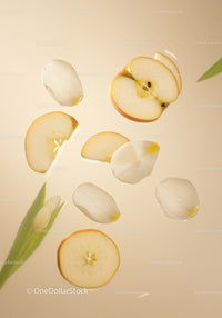 Floating apple slices and white tulip petals on soft beige