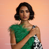 Elegant Woman in Green Dress with Stylish Accessories and Short Hair