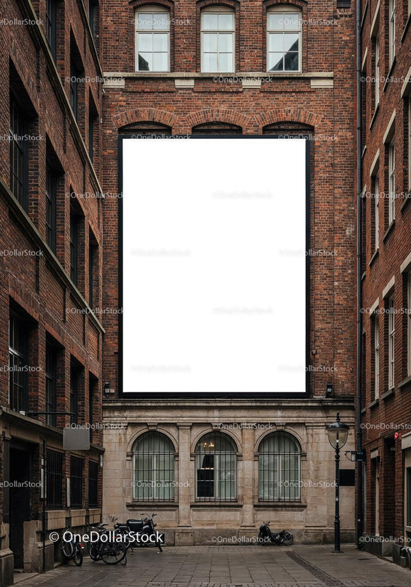 Urban alley with large blank billboard on brick building JPG Mockup Image