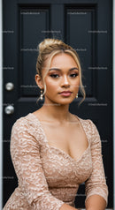 Young woman in lace dress sits by dark door