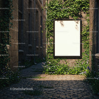 Blank vertical poster on ivy covered brick wall in alley