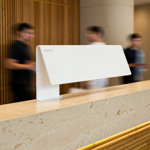 Minimalist white menu stand on beige stone counter JPG Mockup Image