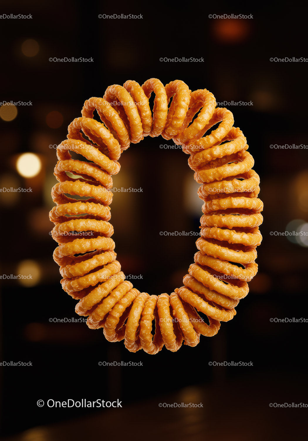 Close up of crispy golden onion rings wreath