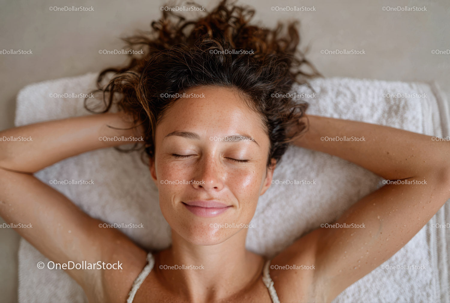 Relaxing Woman Receiving Facial in Spa Setting