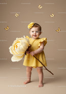Toddler in Yellow Dress Holding Giant Flower with Butterflies