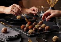 Elegant Chocolate Truffles and Gourmet Sweets on Black Marble Platter