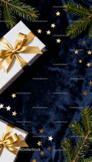 Elegant Christmas gifts with golden ribbons on velvet