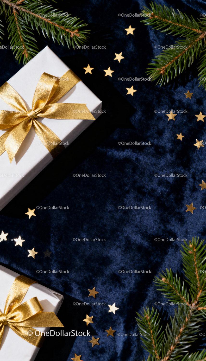 Elegant Christmas gifts with golden ribbons on velvet