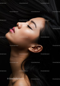 Serene woman with flowing black hair and closed eyes