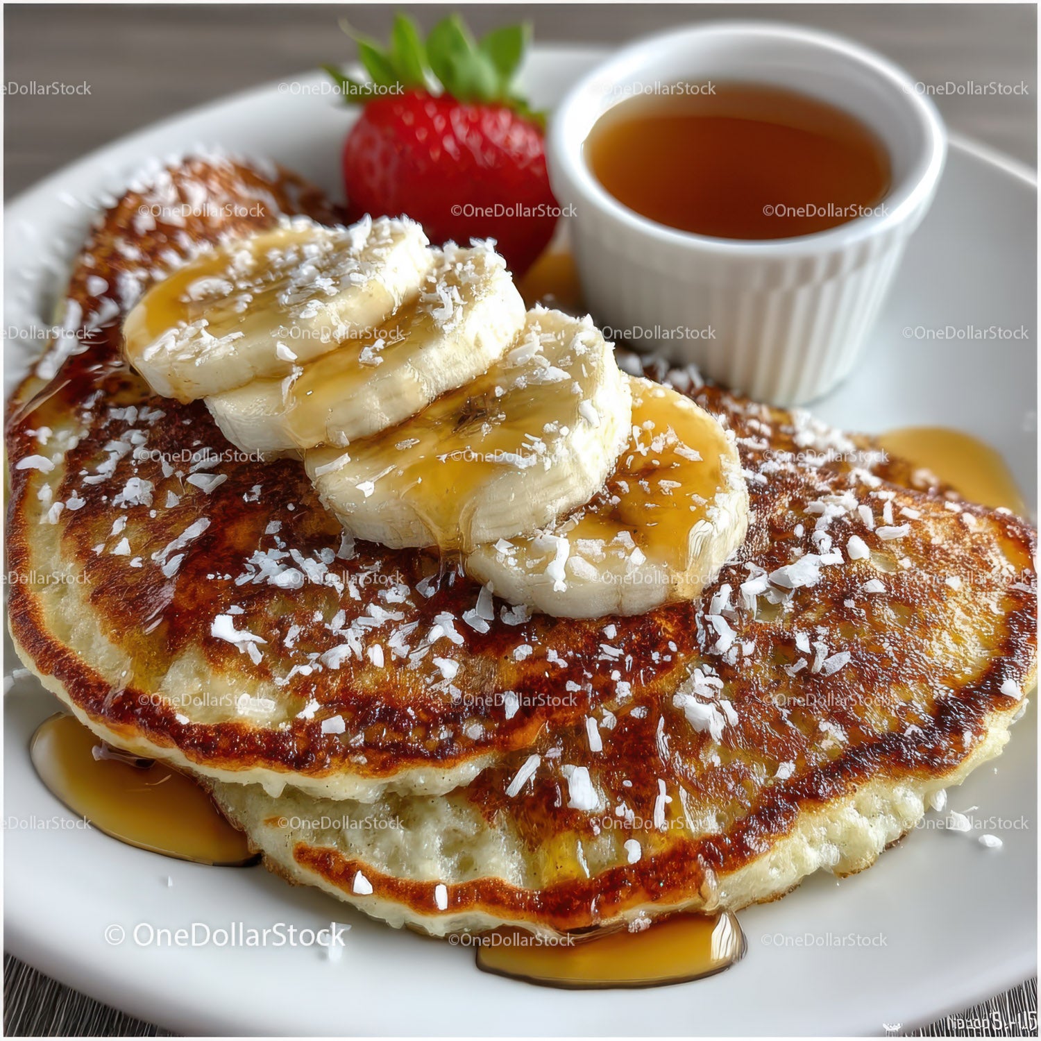 Banana Pancakes with Strawberries and Maple Syrup in a Breakfast Setting