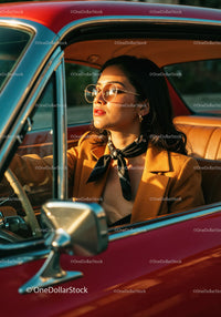 Stylish Woman Driving Vintage Car During Sunset