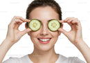 Smiling woman enjoying a refreshing cucumber beauty mask for skincare