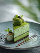Green Matcha Cake with Chocolate Base and Artistic Garnish
