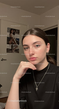Young woman with nose piercings and jewelry in indoor setting