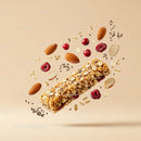 Healthy granola bar with nuts and berries flying